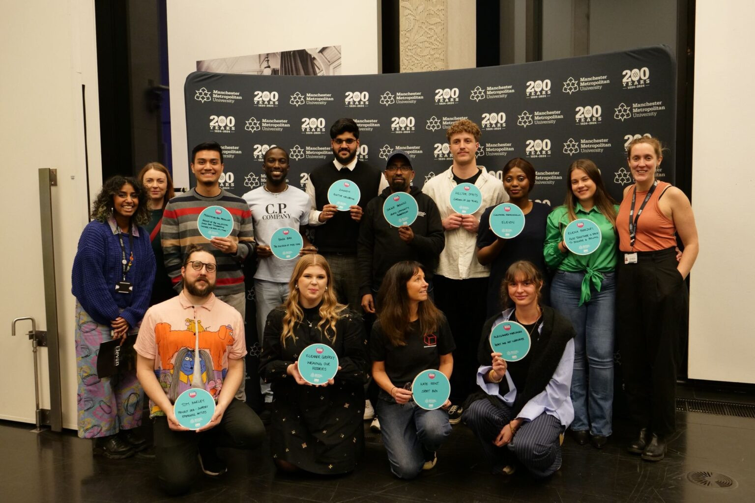 Collection of students holding signs