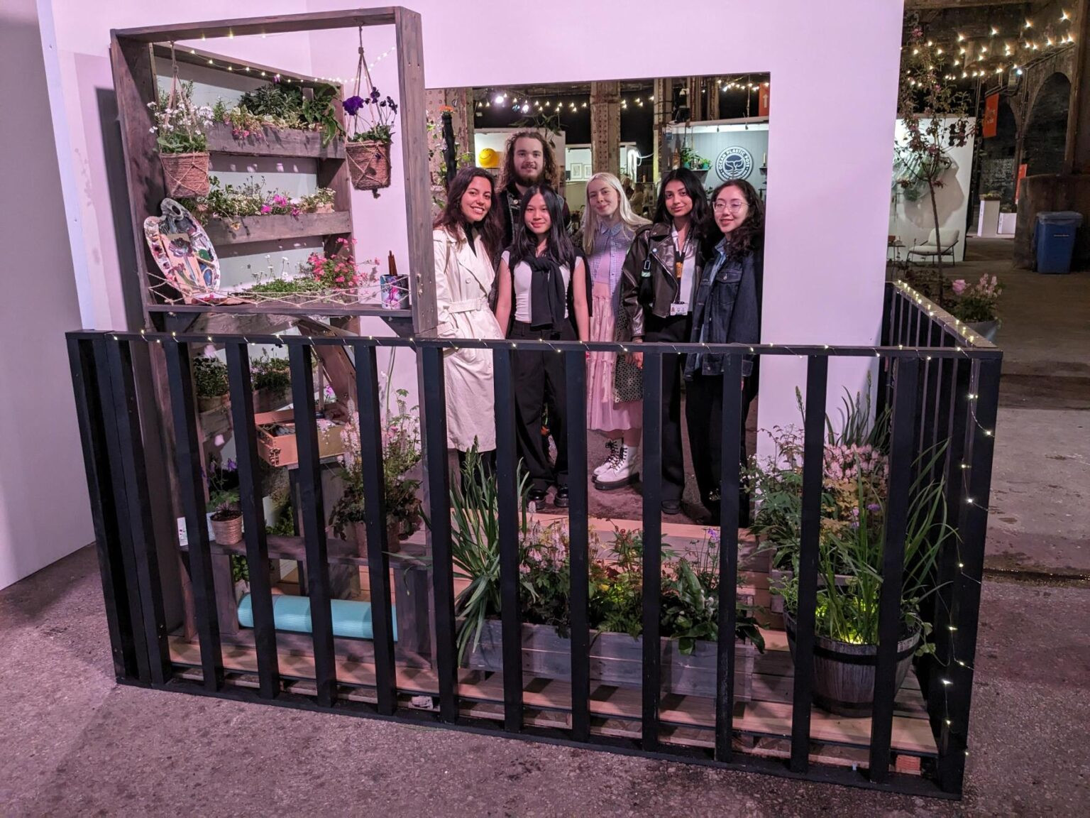 Collection of students at a garden installation